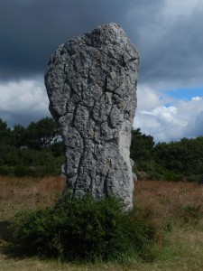 Large heavily weathered megalith, older than the others in the alignment, i.e. incorporated into a redesigned or expanded system of stones at Le Menec, Carnac