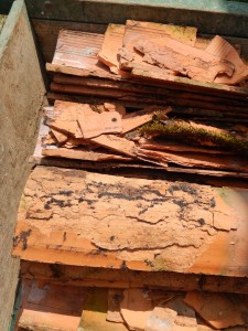 Factory-made roof tiles flaked by frost