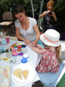 Natalia painting faces and hands