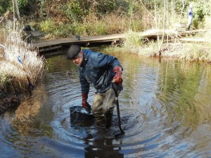 Dragging silt bucket to land